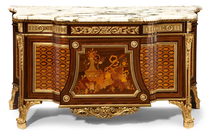 A Louis XVI style gilt bronze mounted marquetry inlaid commode after a model by Jean Henri Riesener early 20th century image 1