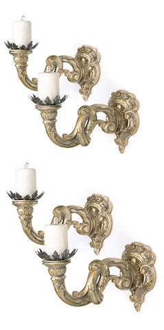 A set of four Baroque style carved silvered wood wall sconces