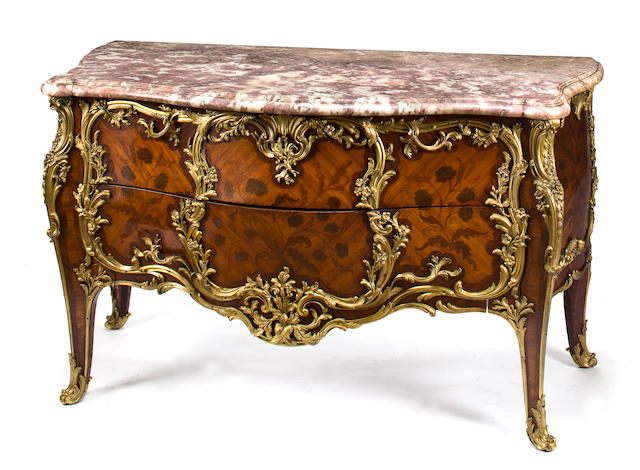 A superb Louis XV style gilt bronze mounted kingwood marquetry commode with pink-beige marble top after a model by Joseph Baumhauer, known as Joseph (d. 1762) attributed to the Maison Jansen late 19th century