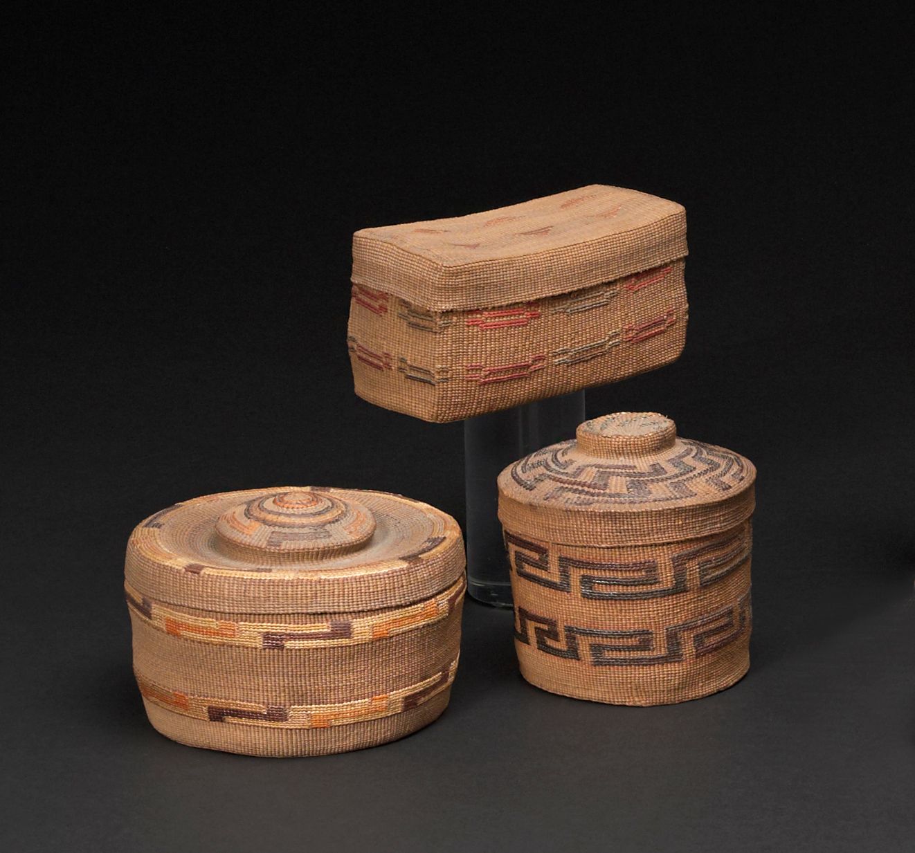 Three Tlingit lidded baskets