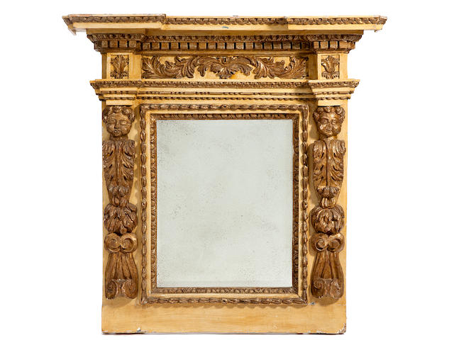 An imposing Italian Baroque parcel gilt paint decorated wall mirror