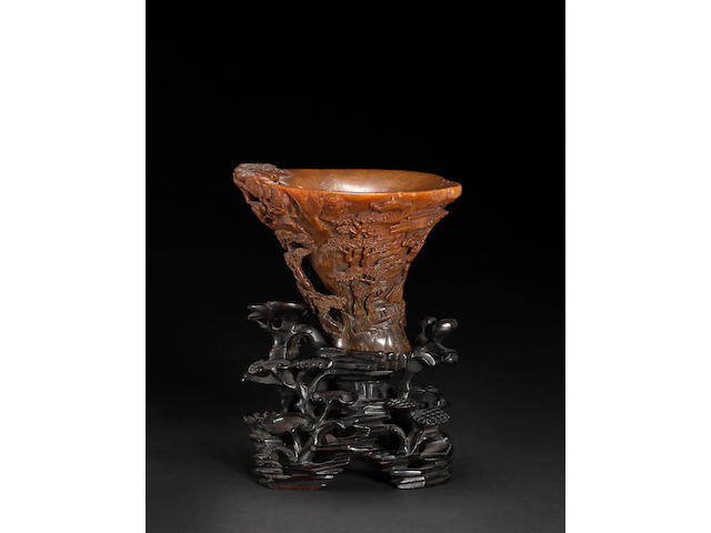 A carved rhinoceros horn libation cup 17th/18th century
