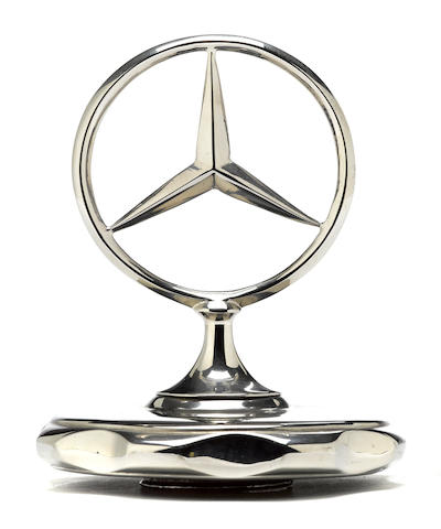 A Mercedes-Benz three pointed star radiator cap,