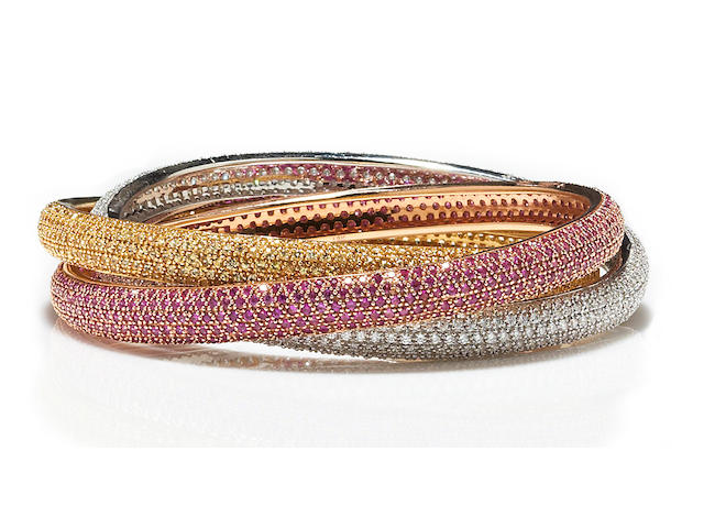 A diamond and pink and yellow sapphire rolling bangle bracelet