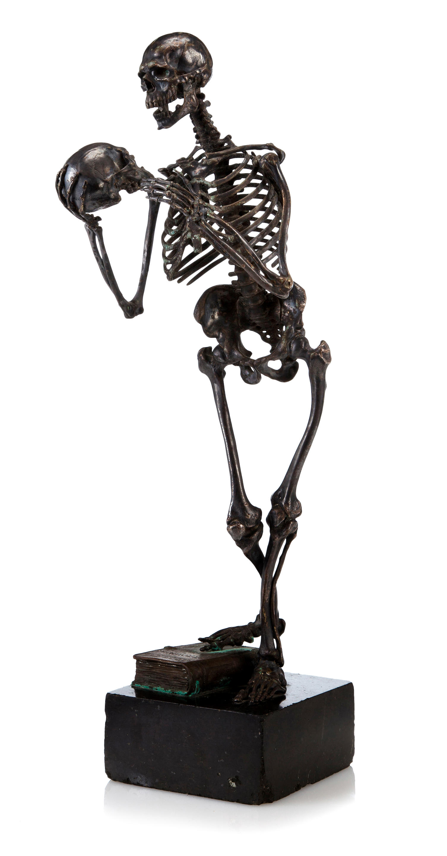 A patinated bronze figure of a skeleton after a model by Carl Kauba...