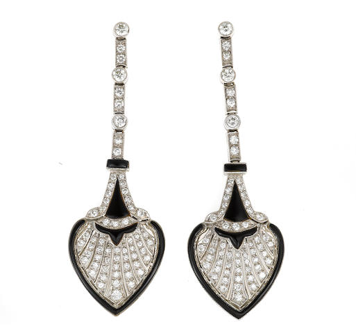 A pair of diamond and black onyx pendant earrings