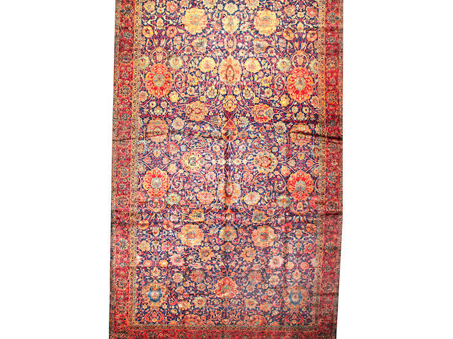 A Kerman carpet South Central Persia size approximately 12ft. 7in. x 25ft.