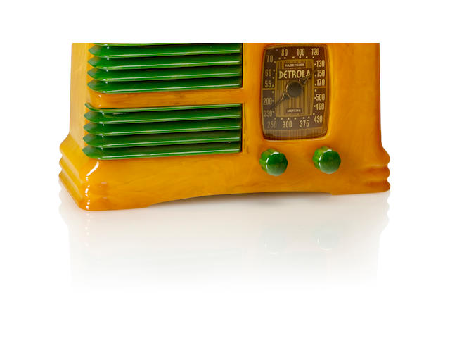A Detrola 281 Split Grille 1939 Marbleized yellow case and emerald green split grille and matching knobs, with remnant of paper label. height 5 1/4in (13.5cm); length 9 1/4in (23.5cm); depth 3 7/8in (10cm)