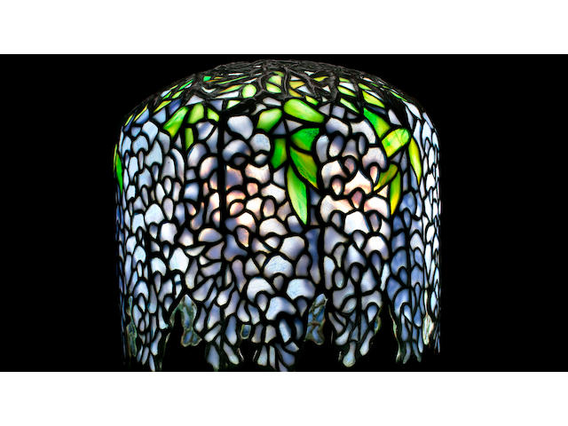 A Tiffany Studios Favrile glass and patinated-bronze Pony Wisteria table lamp circa 1910