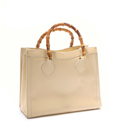 A Gucci tan leather handbag image 1