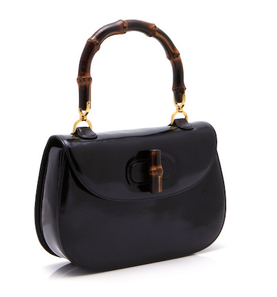 A Gucci black patent leather handbag image 1