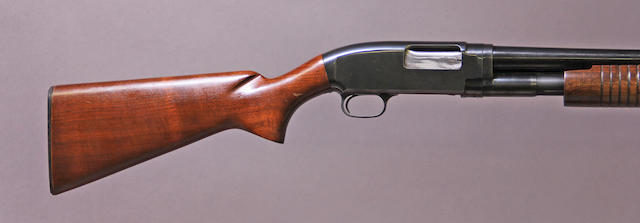 A 12 gauge Winchester Model 12 slide action shotgun