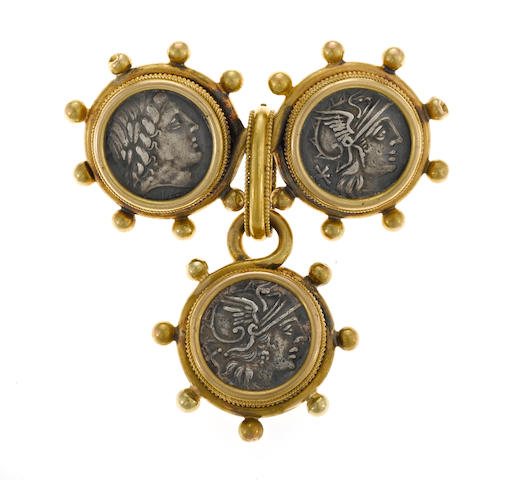 A metal coin and eighteen karat gold brooch and pendant/enhancer set