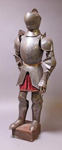 A miniature full suit of armor in 16th century style
