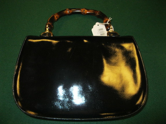 A Gucci black patent leather handbag image 3