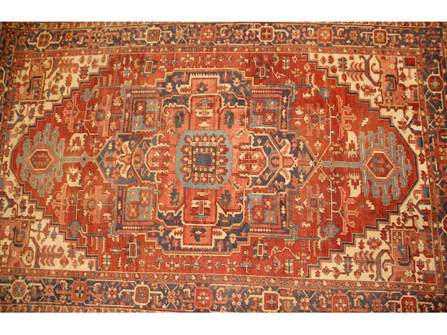 A Heriz carpet size approximately 10ft. 1in. x 16ft. 2in.