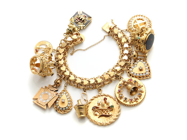 A 14k gold and gem-set charm bracelet