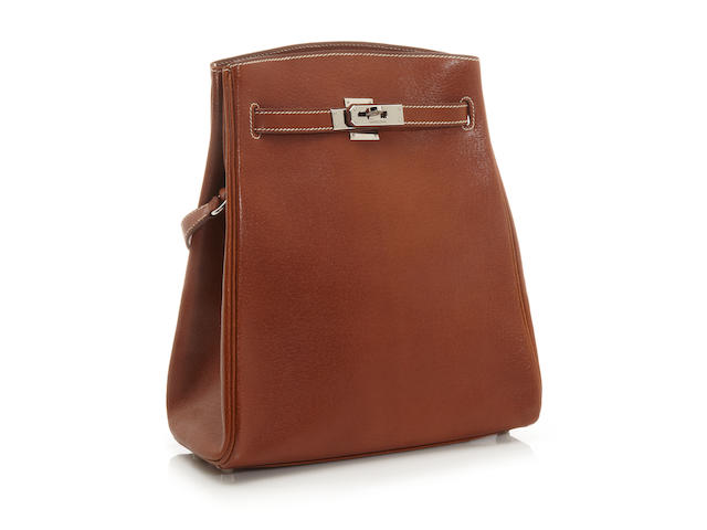 An Herm&#232;s tan leather Kelly Sport shoulder bag