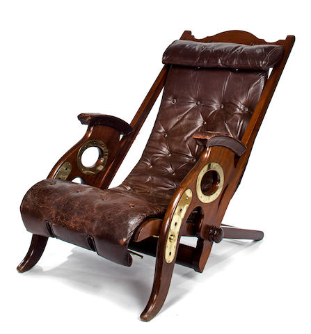 Mahogany and brass tufted leather deck chair<BR /> late 19th/early 20th century 28 x 43 in. (71.1 x 109.2 cm.)approximate height x length - adjustable