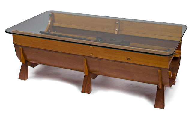 A coffe table made from the center section of a rowing shell<BR /> 20th century 56 x 30 x 17 in. (142.2 x 76.2 x 43.1 cm.)