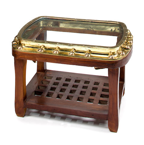 A brass porthole table<BR /> 20th century 19 x 28 x 20 in. (48.2 x 71.1 x 50.8 cm.)
