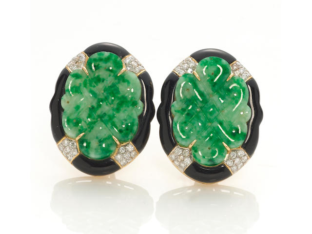 A pair of carved jade, black onyx and diamond earrings