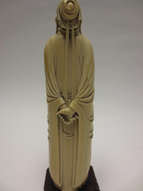 A tinted and carved ivory figure of a scholar Republic period