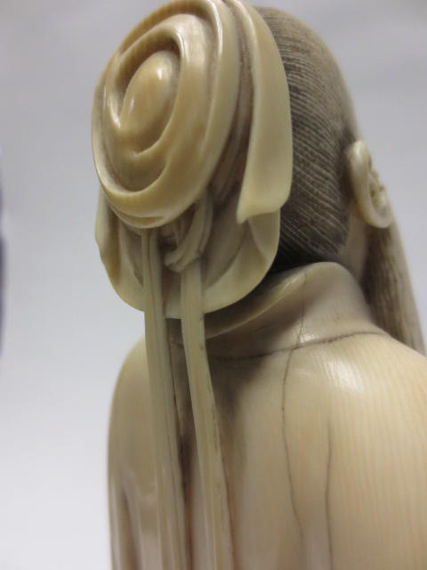 A tinted and carved ivory figure of a scholar Republic period