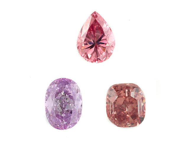Three unmounted colored diamonds