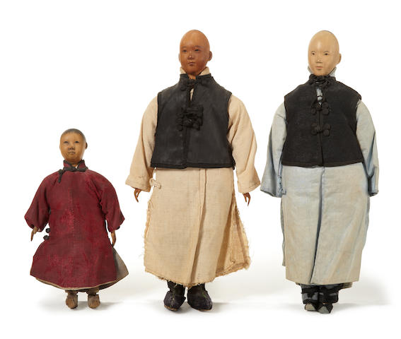 A collection of three Door of Hope dolls