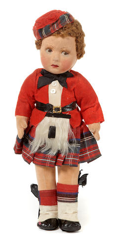 An English felt doll in traditional Scottish costume