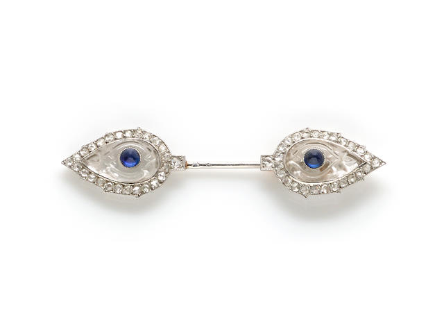 An art deco carved rock crystal, sapphire and diamond "cliquet" jabot brooch, Cartier, French,