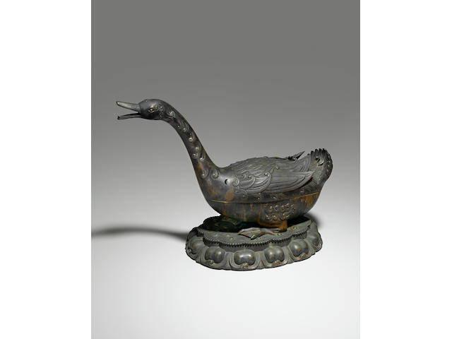 A rare and important cast bronze incense burner and cover in the shape of a goose Ming dynasty