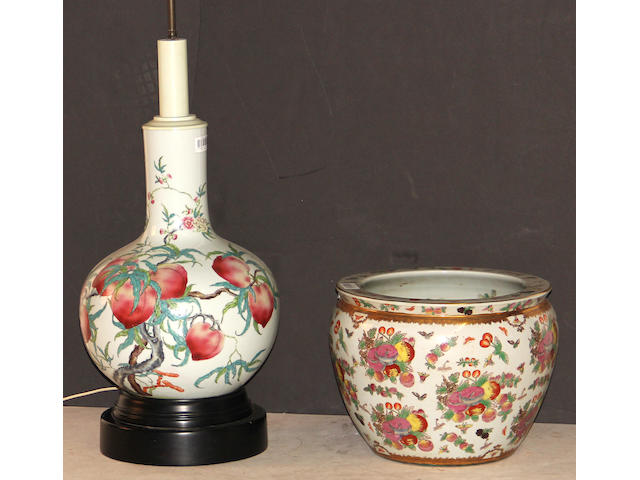 A pair of famille rose enameled stick-neck vases with Nine Peaches decoration Hongxian marks
