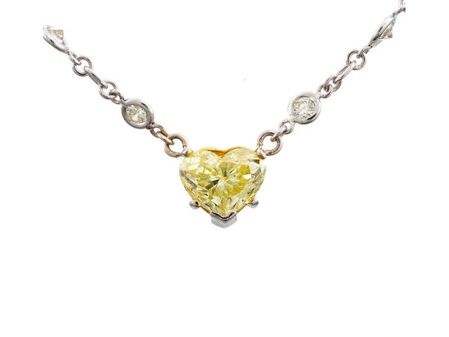 A fancy yellow diamond and diamond necklace