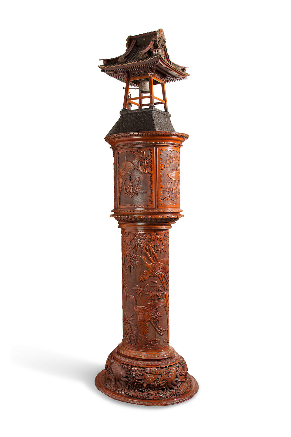 A Remarkable elaborately carved and inlaid automaton striking hall clock Commissioned from Tiffany & Co., New York, the case Japanese, fitted with Tiffany movement No. 759, delivered in April 1901