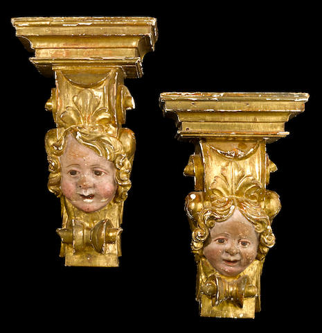 A pair of Italian Rococo polychrome and parcel  giltwood brackets Lucca mid 18th century