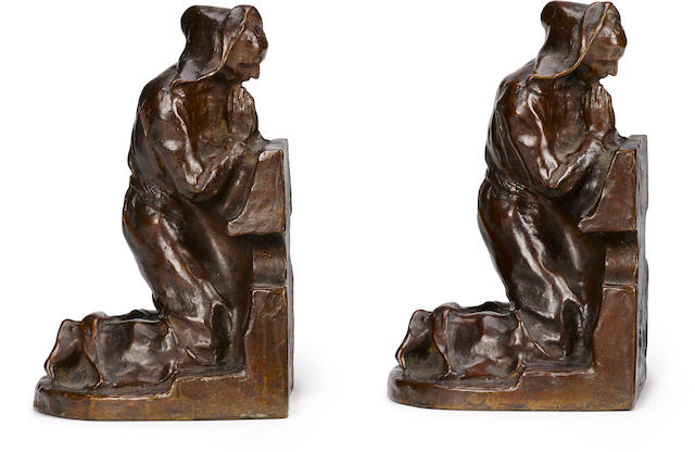 Two patinated bronze figural bookends: kneeling monks after a model by Louis McLellan Potter (American, 1873-1912)