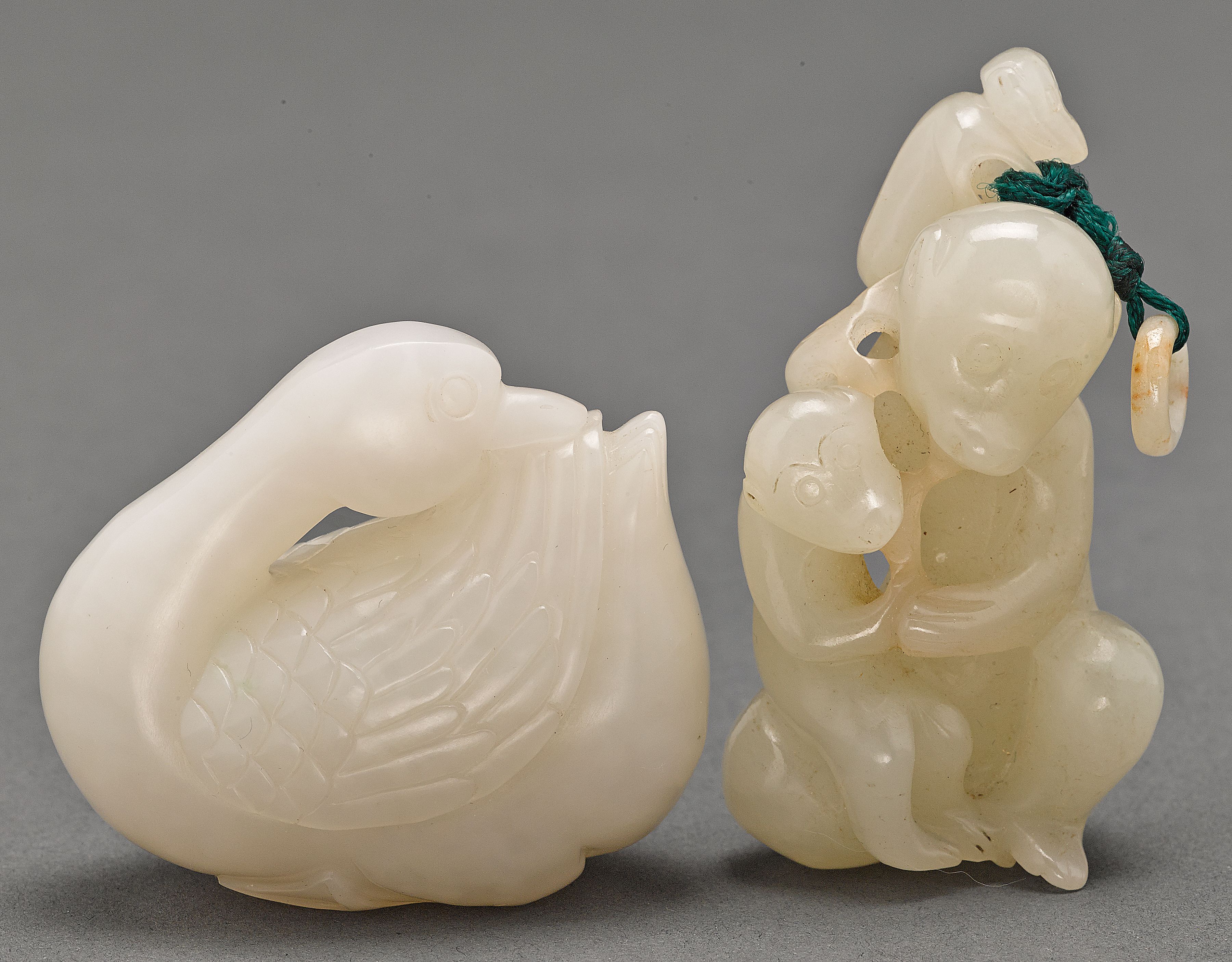 Two small jade toggles