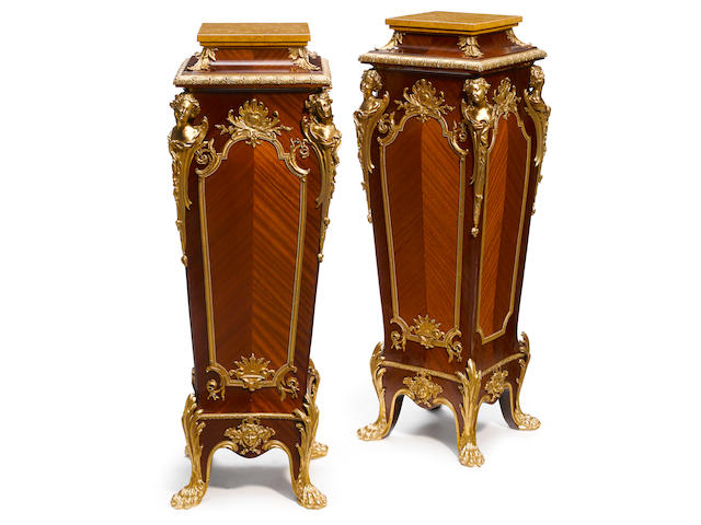 A pair of Louis XV style gilt bronze mounted mahogany pedestals