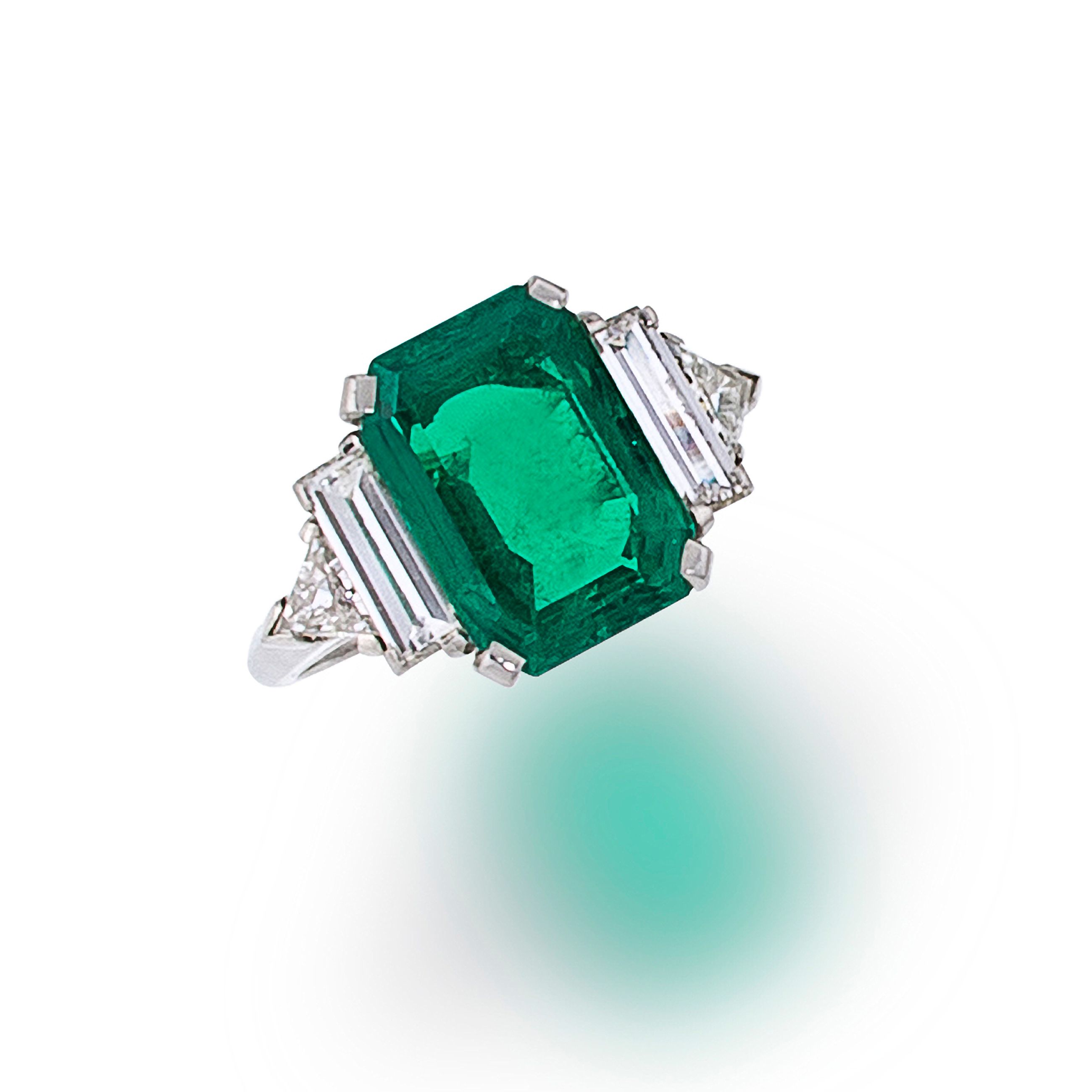 An emerald and diamond ring