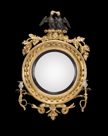 A Regency carved and giltwood girandole mirror 1820-1840