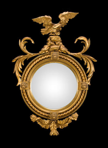 A Regency carved giltwood convex mirror early 19th century