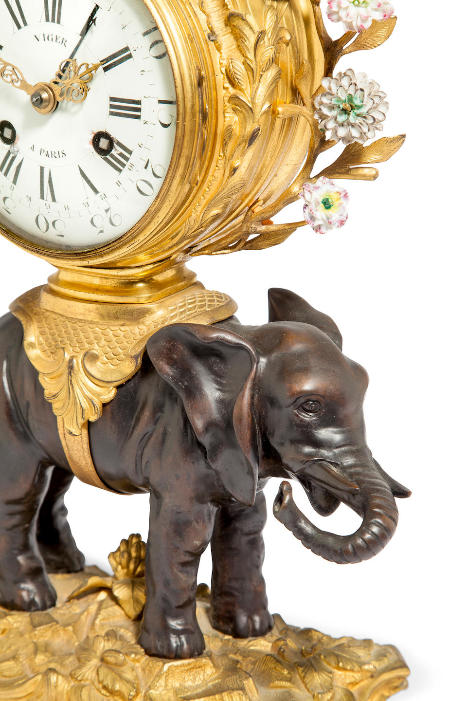 A fine and rare Louis XV porcelain, ormolu and patinated bronze elephant clock the case attributed to Philippe Caffieri, the calendar movement signed Viger &#224; Paris, No. 166mid 18th century