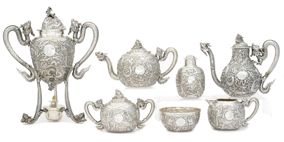 A Chinese Export  silver  seven-piece tea and coffee service undersides of teapot, coffee pot, tea caddy and burner with character marks and marked for Woshing, Shanghai,  fourth quarter 19th century