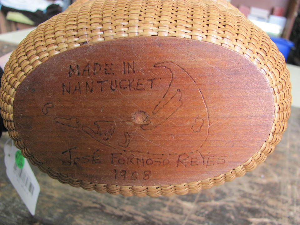 A Nantucket oval lidded basket purse made by Jose Formosa Reyes, dated 1968