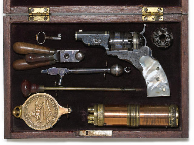A cased engraved and silver banded Colt 'Baby' Paterson Model No. 1 percussion revolver