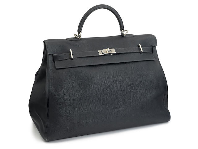 An Herm&#232;s blue leather Travel Kelly handbag