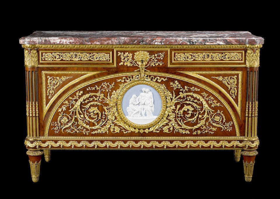 A fine Louis XVI style gilt bronze and porcelain mounted mahogany commode a vantaux after Guillaume BennemanFran&#231;ois Linkefourth quarter  19th century