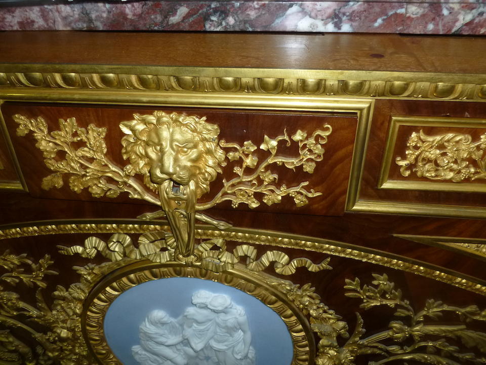 A fine Louis XVI style gilt bronze and porcelain mounted mahogany commode a vantaux after Guillaume BennemanFran&#231;ois Linkefourth quarter  19th century